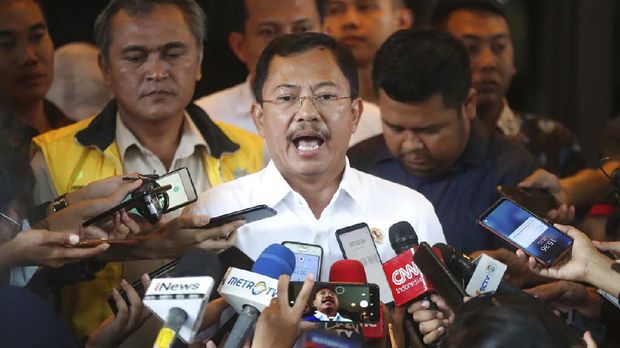 In this Feb. 15, 2020, photo, Indonesian Health Minister Terawan Agus Putranto, center, talks to the media at Halim Perdanakusuma Airport in Jakarta, Indonesia. While its neighbors scrambled early this year to try to contain the spread of the new coronavirus, the government of the world’s fourth most populous nation insisted that everything was fine. Only after the first cases were confirmed in March did President Joko Widodo acknowledge that his government was deliberately holding back information about the spread of the virus to prevent the public from panicking. The country now has the the highest death toll in Asia after China. (AP Photo/Achmad Ibrahim)