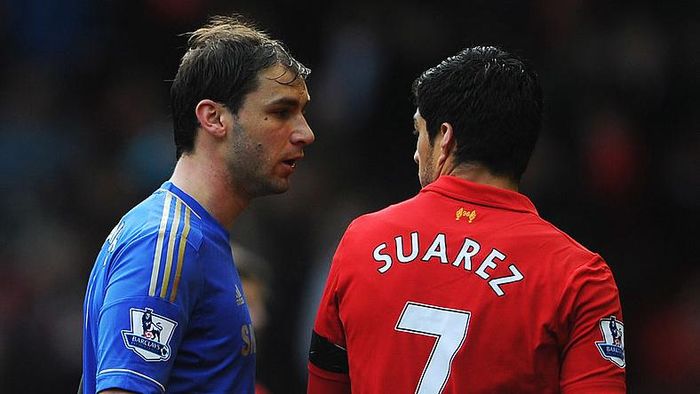 Luis Suarez, Branislav Ivanovic LIVERPOOL, ENGLAND - APRIL 21: Branislav Ivanovic of Chelsea talks with Luis Suarez of Liverpool as they walk in for half time during the Barclays Premier League match between Liverpool and Chelsea at Anfield on April 21, 2013 in Liverpool, England. (Photo by Michael Regan/Getty Images)