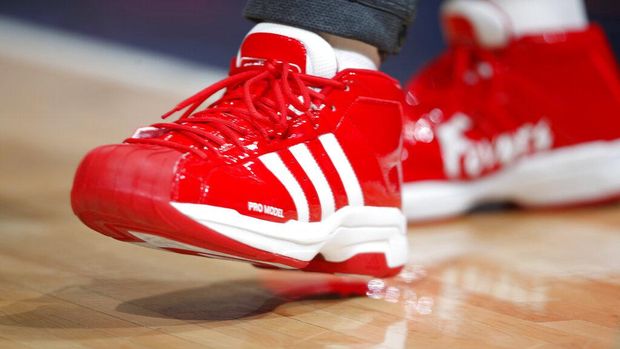 FILE - In this file photo dated Wednesday, Dec. 25, 2019, New Orleans Pelicans forward Derrick Favors wears Christmas-themed Adidas Pro Model Superstars shoes in the first half of an NBA basketball game Wednesday, Dec. 25, 2019, in Denver, USA.  Sports apparel and shoe company Adidas said Tuesday April 14, 2020, it has been approved by the German government for a 3 billion-euro ( US dollars 3.3 billion) emergency loan to help the company get through a period of lost business due to the COVID-19 coronavirus outbreak. (AP Photo/David Zalubowski, FILE)