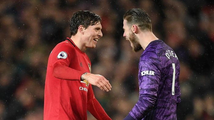 MANCHESTER, ENGLAND - MARCH 08: Victor Lindelof of Manchester United celebrates with David De Gea of Manchester United after the Premier League match between Manchester United and Manchester City at Old Trafford on March 08, 2020 in Manchester, United Kingdom. (Photo by Michael Regan/Getty Images)