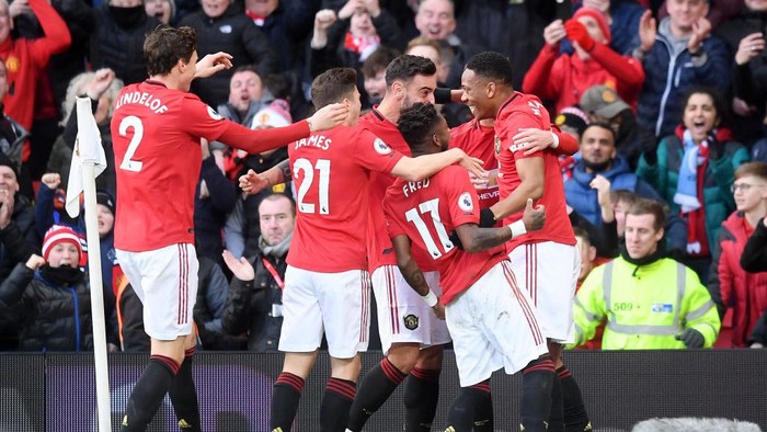 MANCHESTER, ENGLAND - MARCH 08: Anthony Martial of Manchester United celebrates with his team after scoring his sides first goal during the Premier League match between Manchester United and Manchester City at Old Trafford on March 08, 2020 in Manchester, United Kingdom. (Photo by Michael Regan/Getty Images)