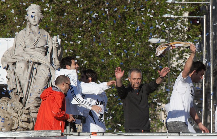 Jose Mourinho MADRID, SPAIN - MAY 03: Head coach Jose Mourinho (R) of Real Madrid celebrates with supporters in Plaza de Cibeles on May 3, 2012 in Madrid, Spain. Real Madrid are celebrating winning the Spanish Liga title for the first time since 2008, and for the 32nd time in their history. (Photo by Pablo Blazquez Dominguez/Getty Images)