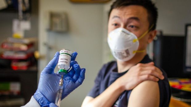 Illustrative picture of Chinese male getting vaccinated against coronavirus