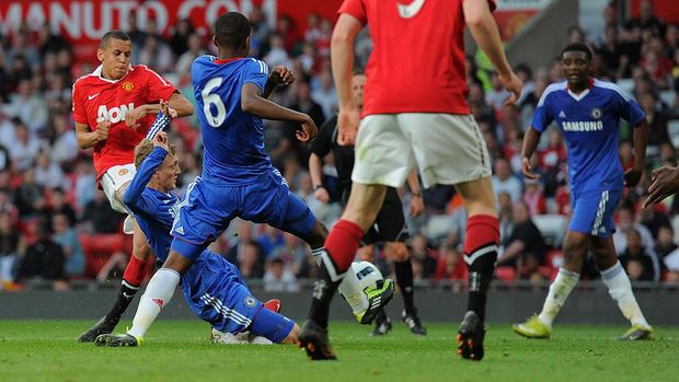 MANCHESTER, ENGLAND - APRIL 20: Ravel Morrison of Manchester United shoots and the ball deflects off George Saville of Chelsea for the first goal during the FA Youth Cup Semi Final 2nd Leg between Manchester United and Chelsea at Old Trafford on April 20, 2011 in Manchester, England.  (Photo by Michael Regan/Getty Images)