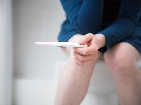 The photo was taken from a front view in a bathroom against a light background.