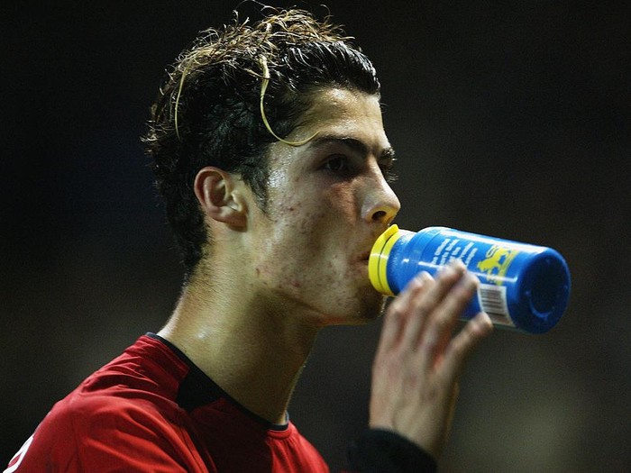 MANCHESTER - NOVEMBER 4:  Cristano Ronaldo of Manchester United takes a drink during the UEFA Champions League match between Manchester United and Rangers on November 4, 2003 at Old Trafford in Manchester, England.  Manchester United won the match 3-0.  (Photo by Laurence Griffiths/Getty Images)