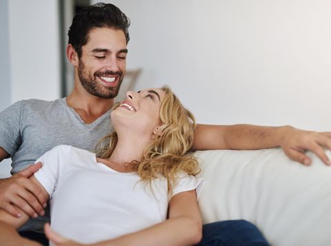 Shot of a young couple relaxing at home