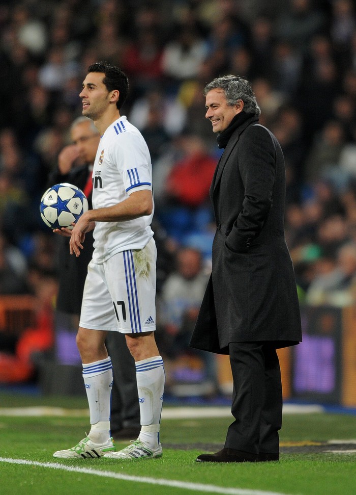 MADRID, SPAIN - FEBRUARY 02:  Head coach Jose Mourinho of Real Madrid smiles as he stands by Alvaro Arbeloa of Real Madrid during the semi-final Copa del Rey second leg match between Real Madrid and Sevilla at Estadio Santiago Bernabeu on February 2, 2011 in Madrid, Spain.  (Photo by Jasper Juinen/Getty Images)