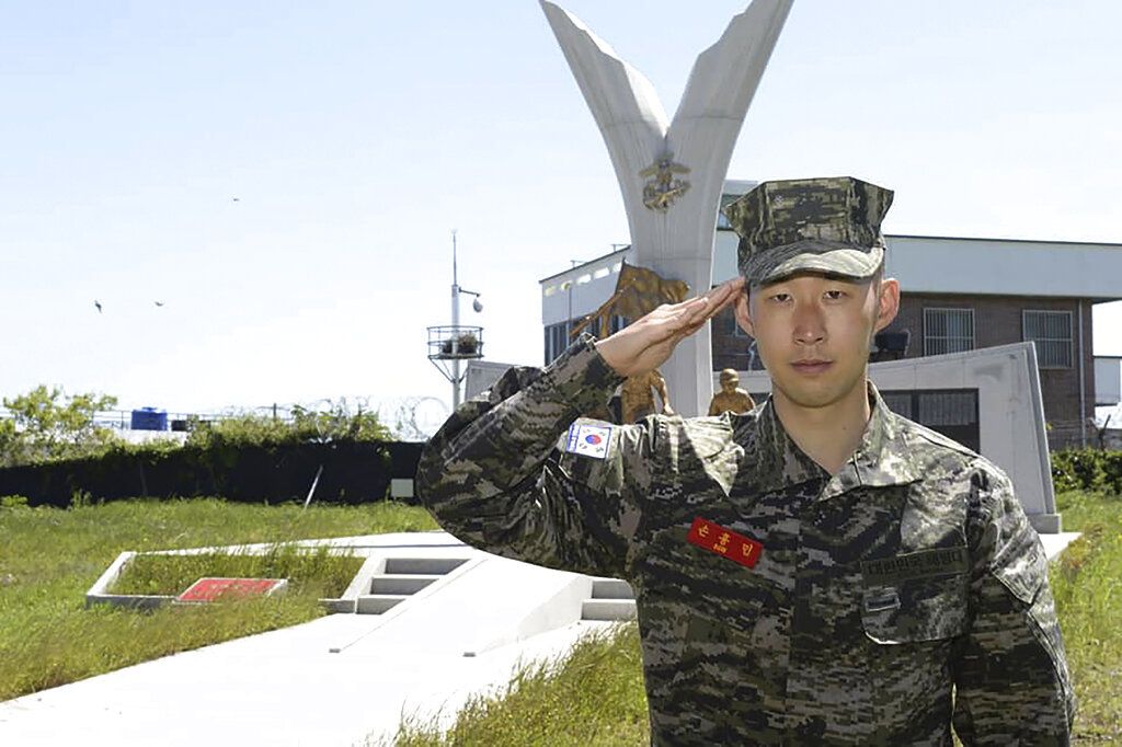 In this undated photo provided by South Korea Marine Corps' Facebook on Friday, May 8, 2020, Tottenham Hotspur forward Son Heung-min salutes at a Marine Corps boot camp in Seogwipo on Jeju Island, South Korea. Son finished his three-week military training in South Korea on Friday and was right near the top of the class.(South Korea Marine Corps' Facebook via AP).