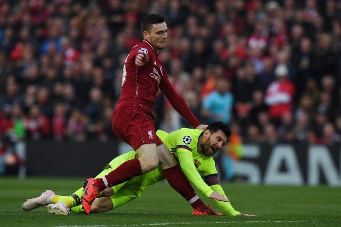 Barcelonas Argentinian striker Lionel Messi (R) is tackled by Liverpools Scottish defender Andrew Robertson during the UEFA Champions league semi-final second leg football match between Liverpool and Barcelona at Anfield in Liverpool, north west England on May 7, 2019. (Photo by Paul ELLIS / AFP)