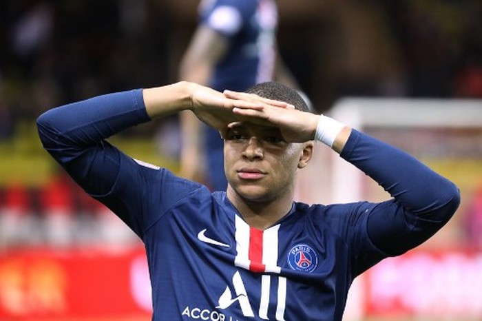(FILES) In this file photo taken on January 15, 2020 Paris Saint-Germains French forward Kylian Mbappe reacts during  the French L1 football match between Monaco (ASM) and Paris Saint-Germain (PSG) at the Louis II Stadium in Monaco on January 15, 2020. - The football season in France has been declared over following a league vote on Thursday, with Paris Saint-Germain being named as champions. PSG topped the Ligue 1 table by 12 points from Marseille when the season was suspended in mid-March because of the coronavirus outbreak, which has gone on to kill more than 24,000 people in France. (Photo by Valery HACHE / AFP)