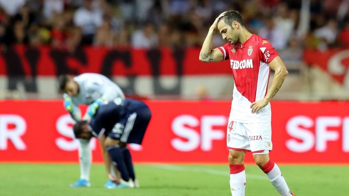 Monacos Spanish midfielder Cesc Fabregas reacts during the French L1 football match between AS Monaco (ASM) and Olympique Lyonnais (OL) at the Stade Louis II stadium in Monaco on August 9, 2019. (Photo by VALERY HACHE / AFP)