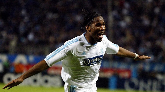 Marseilles Ivorian forward Didier Drogba jubilates after scoring the second goal during the UEFA Cup semi-final second leg football match against Newcastle, 06 May 2004 at the Velodrome stadium in Marseille.  AFP PHOTO GERARD JULIEN (Photo by GERARD JULIEN / AFP)