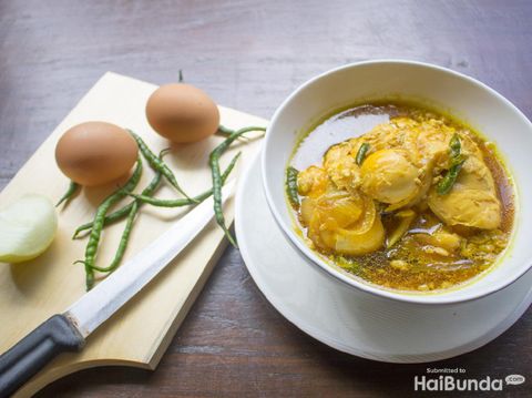 Opor ayam, chicken cooked in coconut milk from Central Java, Indonesia. Served with lontong and sambal. Popular dish for lebaran or Eid al-Fitr