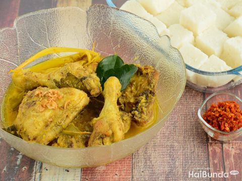 Opor ayam, chicken cooked in coconut milk from Central Java, Indonesia. Served with lontong and sambal. Popular dish for lebaran or Eid al-Fitr