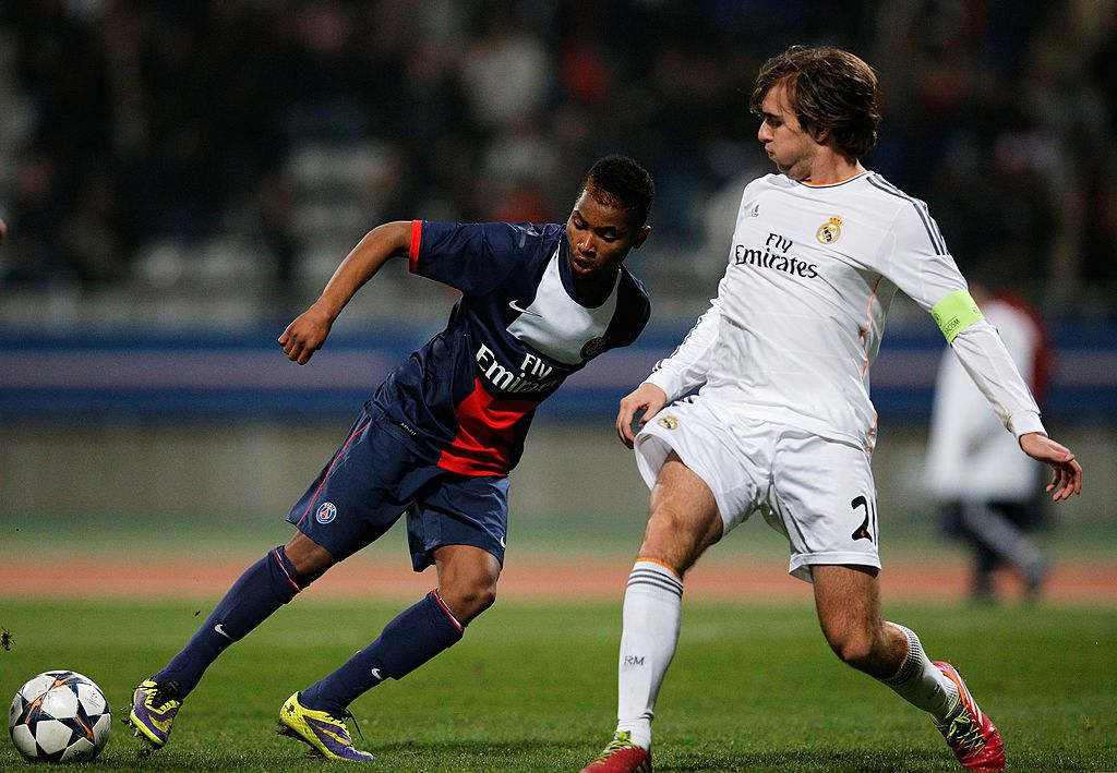 PARIS, FRANCE - MARCH 11:  Bryan Labissiere of PSG and Ivan Saez of Real Madrid battle for the ball during the UEFA Youth League Quarter Final match between Paris Saint-Germain FC and Real Madrid at Stade Charlety on March 11, 2014 in Paris, France.  (Photo by Dean Mouhtaropoulos/Getty Images)