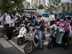 Riuhnya Warga Wuhan yang Gemar Bersepeda Listrik
