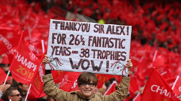MANCHESTER, ENGLAND - MAY 12:  A Manchester United fan shows off a banner to honour Manager Sir Alex Ferguson prior to the Barclays Premier League match between Manchester United and Swansea City at Old Trafford on May 12, 2013 in Manchester, England.  (Photo by Alex Livesey/Getty Images)