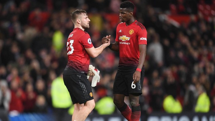 MANCHESTER, ENGLAND - DECEMBER 30:  Paul Pogba of Manchester United celebrates victory with Luke Shaw after the Premier League match between Manchester United and AFC Bournemouth at Old Trafford on December 30, 2018 in Manchester, United Kingdom.  (Photo by Michael Regan/Getty Images)