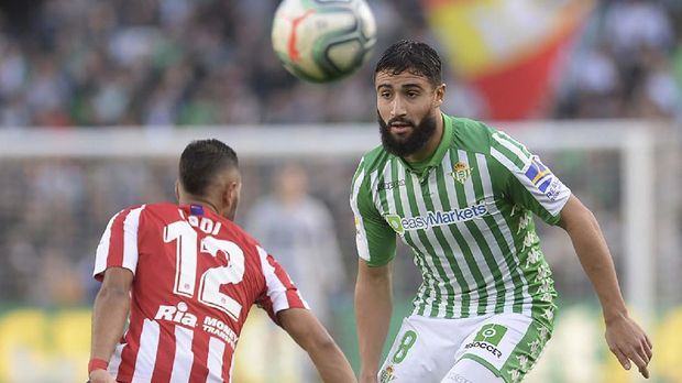 Nabil Fekir di Real Betis Real Betis' French midfielder Nabil Fekir (R) vies Atletico Madrid's Brazilian defender Renan Lodi (L) during the Spanish league football match Real Betis against Club Atletico de Madrid at the Benito Villamarin stadium in Seville on December 22, 2019. (Photo by CRISTINA QUICLER / AFP)