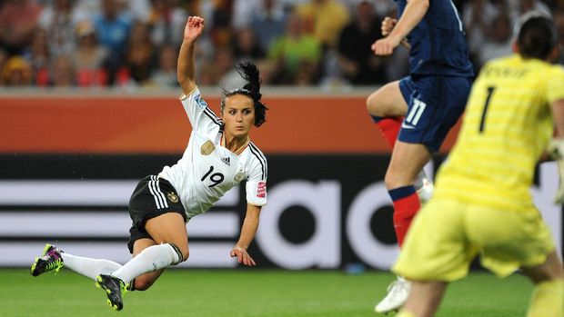 Germany's midfielder Fatmire Bajramaj (L) plays the ball during the France vs Germany Group A match of the FIFA women's football World Cup on July 5, 2011 in Moenchengladbach, western Germany. Germany won the match 2-4. AFP PHOTO / PATRIK STOLLARZ (Photo by PATRIK STOLLARZ / AFP)