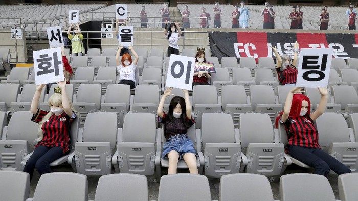 In this May 17, 2020 photo, Cheering mannequins are installed at the empty spectators seats before the start of soccer match between FC Seoul and Gwangju FC at the Seoul World Cup Stadium in Seoul, South Korea. A South Korean professional soccer club has apologized after being accused of putting sex dolls in empty stands during a match Sunday in Seoul. In a statement, FC Seoul expressed 