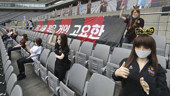 In this May 17, 2020, photo, cheering mannequins are installed at the empty spectators seats before the start of a soccer match between FC Seoul and Gwangju FC at the Seoul World Cup Stadium in Seoul, South Korea. A South Korean professional soccer club has apologized after being accused of putting sex dolls in empty stands during a match Sunday in Seoul. In a statement, FC Seoul expressed 