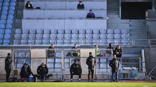 Journalists on the press tribune follow the Estonia's Meistriliiga, round two, soccer match between TJK Legion and FCI Levadia teams at Kadriorg Stadium in Tallinn, Estonia, Tuesday, May 19, 2020. The match is played without spectators due to the highly contagious CODIC-19 coronavirus. (AP Photo/Hendrik Osula)