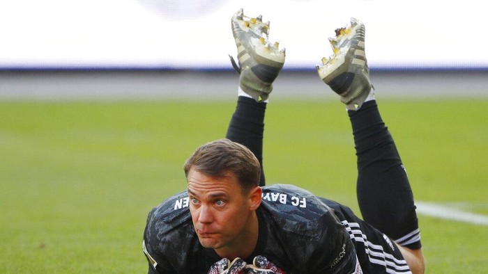Goal keeper Manuel Neuer of Munich lies on the pitch during the German Bundesliga soccer match between Union Berlin and Bayern Munich in Berlin, Germany, Sunday, May 17, 2020. The German Bundesliga becomes the worlds first major soccer league to resume after a two-month suspension because of the coronavirus pandemic. (AP Photo/Hannibal Hanschke, Pool)