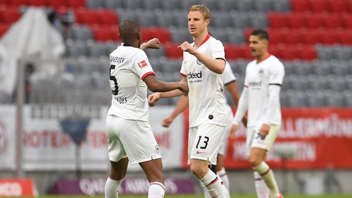 Martin Hinteregger MUNICH, GERMANY - MAY 23: Martin Hinteregger of Eintracht Frankfurt celebrates with Gelson Fernandes after scoring his teams second goal during the Bundesliga match between FC Bayern Muenchen and Eintracht Frankfurt at Allianz Arena on May 23, 2020 in Munich, Germany. (Photo by Andreas Gebert/Pool via Getty Images)