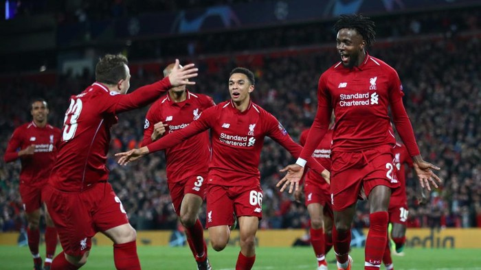 LIVERPOOL, ENGLAND - MAY 07:  Divock Origi of Liverpool (27) celebrates as he scores his teams fourth goal with team mates during the UEFA Champions League Semi Final second leg match between Liverpool and Barcelona at Anfield on May 07, 2019 in Liverpool, England. (Photo by Clive Brunskill/Getty Images)