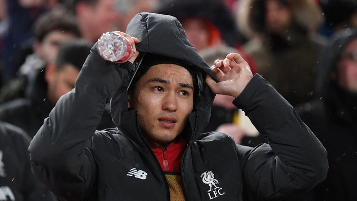 LIVERPOOL, ENGLAND - MARCH 11: Takumi Minamino of Liverpool looks on prior to the UEFA Champions League round of 16 second leg match between Liverpool FC and Atletico Madrid at Anfield on March 11, 2020 in Liverpool, United Kingdom.  (Photo by Laurence Griffiths/Getty Images)