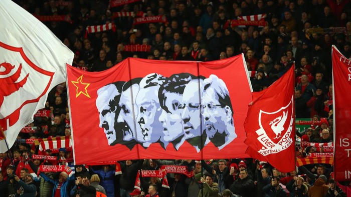 LIVERPOOL, ENGLAND - FEBRUARY 24: Liverpool fans hold up flags inside the stadium prior to kick off during the Premier League match between Liverpool FC and West Ham United at Anfield on February 24, 2020 in Liverpool, United Kingdom. (Photo by Clive Brunskill/Getty Images)