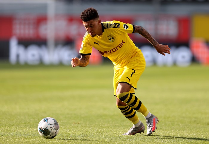 PADERBORN, GERMANY - MAY 31: Jadon Sancho of Dortmund runs with the ball during the Bundesliga match between SC Paderborn 07 and Borussia Dortmund at Benteler Arena on May 31, 2020 in Paderborn, Germany. (Photo by Lars Baron/Getty Images)