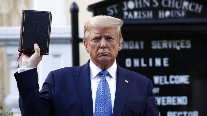 President Donald Trump holds a Bible as he visits outside St. Johns Church across Lafayette Park from the White House Monday, June 1, 2020, in Washington. Part of the church was set on fire during protests on Sunday night. (AP Photo/Patrick Semansky)
