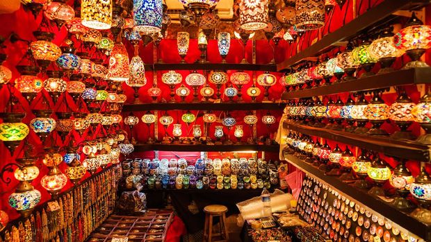 Istanbul, Turkey - October 21, 2014: a store in Grand bazaar, selling typical multicolored turkish lights. Some people are visible in the image.