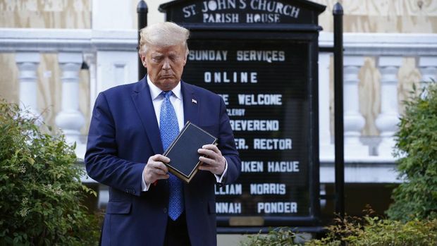 Donald Trump President Donald Trump holds a Bible as he visits outside St. John's Church across Lafayette Park from the White House Monday, June 1, 2020, in Washington. Part of the church was set on fire during protests on Sunday night. (AP Photo/Patrick Semansky)