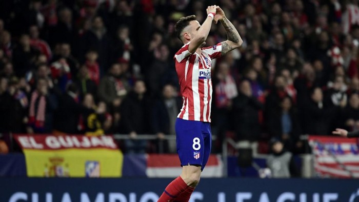 Atletico Madrids Spanish midfielder Saul Niguez celebrates after scoring the opening goal during the UEFA Champions League, round of 16, first leg football match between Club Atletico de Madrid and Liverpool FC at the Wanda Metropolitano stadium in Madrid on February 18, 2020. (Photo by JAVIER SORIANO / AFP)