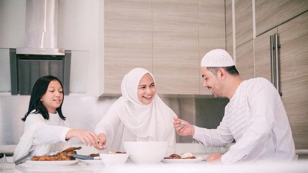 Islamic women friends dining together with happiness
