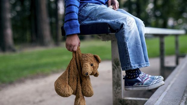 Family Problems. Cute Little Girl Suffering From Parents Arguing, Sitting On Floor With Teddy Bear, Feeling Abandonned And Lonely
