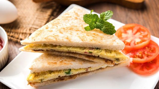 Indian Bread omelette / omlet / omlete sandwich served with tomato ketchup