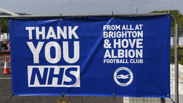 BRIGHTON, UNITED KINGDOM - APRIL 24: A sign from Brighton and Hove Albion football club thanking the NHS is displayed at the Amex Stadium, which is being used as a coronavirus testing centre, on April 24, 2020 in Brighton, United Kingdom. The British government has extended the lockdown restrictions first introduced on March 23 that are meant to slow the spread of COVID-19. (Photo by Mike Hewitt/Getty Images)