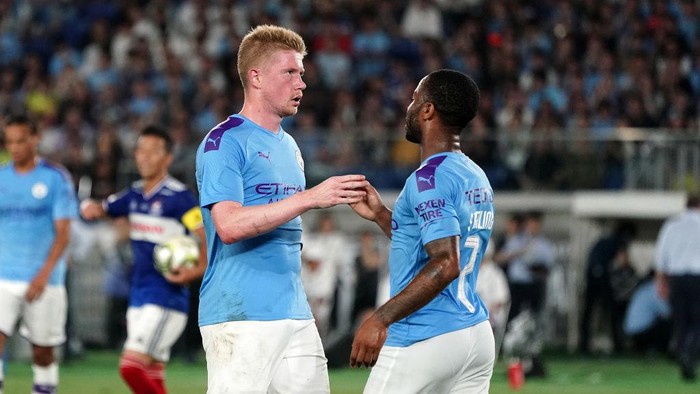 YOKOHAMA, JAPAN - JULY 27: Raheem Sterling of Manchester  celebrates after scoring the second goal of his team with Kevin De Bruyneduring the preseason friendly match between Yokohama F.Marinos and Manchester City at Nissan Stadium on July 27, 2019 in Yokohama, Kanagawa, Japan. (Photo by Koji Watanabe/Getty Images)