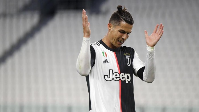 Juventus Cristiano Ronaldo reacts during an Italian Cup second leg soccer match between Juventus and AC Milan at the Allianz stadium, in Turin, Italy, Friday, June 12, 2020. The match was being played without spectators because of the coronavirus lockdown. (AP Photo/Luca Bruno)