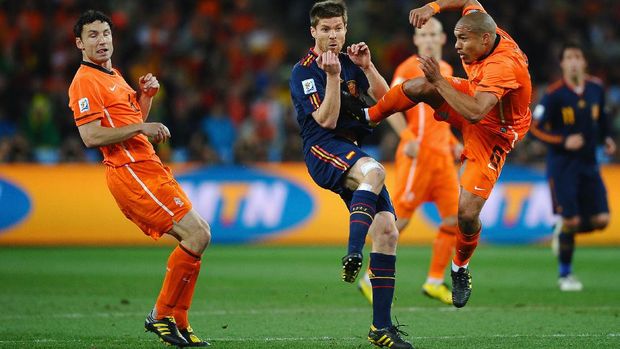 JOHANNESBURG, SOUTH AFRICA - JULY 11:  Nigel De Jong of the Netherlands tackles Xabi Alonso of Spain with a kick in the chest during the 2010 FIFA World Cup South Africa Final match between Netherlands and Spain at Soccer City Stadium on July 11, 2010 in Johannesburg, South Africa.  (Photo by Laurence Griffiths/Getty Images)