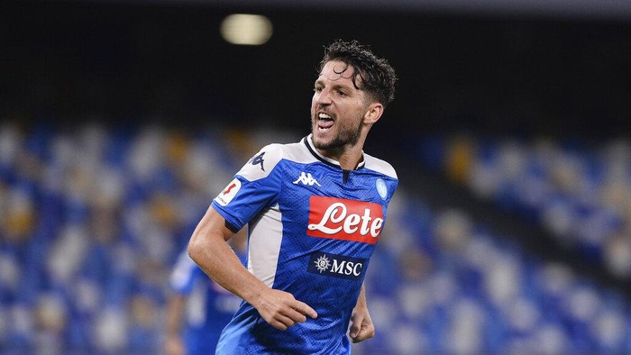 Napolis Dries Mertens celebrates scoring his sides opening goal during the Italian Cup second leg semifinal soccer match between Napoli and Inter Milan, at the Naples San Paolo Stadium, Italy, Saturday, June 13, 2020. The match is being played without spectators because of the COVID-19 restriction measures. (Cafaro/LaPresse via AP)