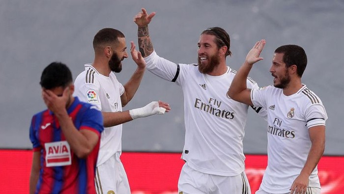 MADRID, SPAIN - JUNE 14: Sergio Ramos of Real Madrid celebrates with Karim Benzema of Real Madrid and Eden Hazard of Real Madrid after scoring his teams second goal during the Liga match between Real Madrid CF and SD Eibar SAD at Estadio Alfredo Di Stefano on June 14, 2020 in Madrid, Spain. (Photo by Gonzalo Arroyo Moreno/Getty Images)
