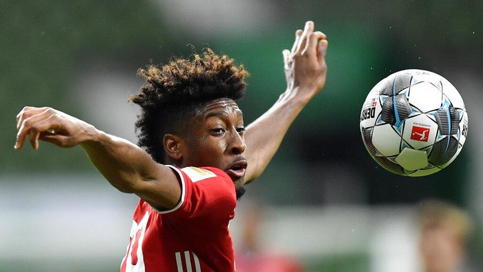 Bayerns Kingsley Coman controls the ball during the German Bundesliga soccer match between Werder Bremen and Bayern Munich in Bremen, Germany, Tuesday, June 16, 2020. Because of the coronavirus outbreak all soccer matches of the German Bundesliga take place without spectators. (AP Photo/Martin Meissner, Pool)