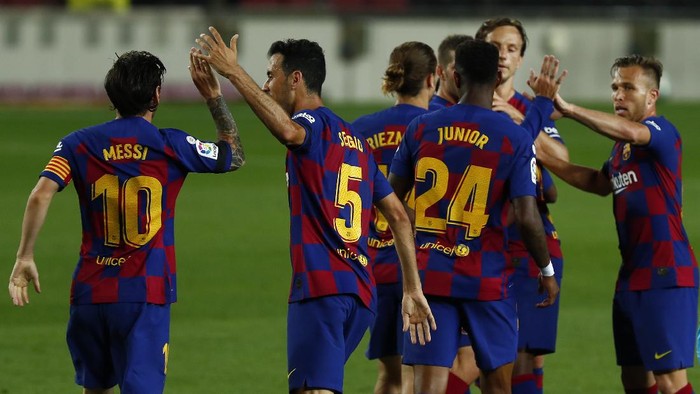 Barcelonas players celebrate Ansu Fatis goal during the Spanish La Liga soccer match between FC Barcelona and Leganes at the Camp Nou stadium in Barcelona, Spain, Tuesday, June 16, 2020. (AP Photo/Joan Montfort)