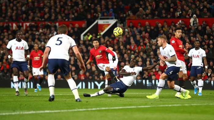MANCHESTER, ENGLAND - DECEMBER 04: Jesse Lingard of Manchester United shoots as Davinson Sanchez of Tottenham Hotspur attempts to block during the Premier League match between Manchester United and Tottenham Hotspur at Old Trafford on December 04, 2019 in Manchester, United Kingdom. (Photo by Michael Steele/Getty Images)